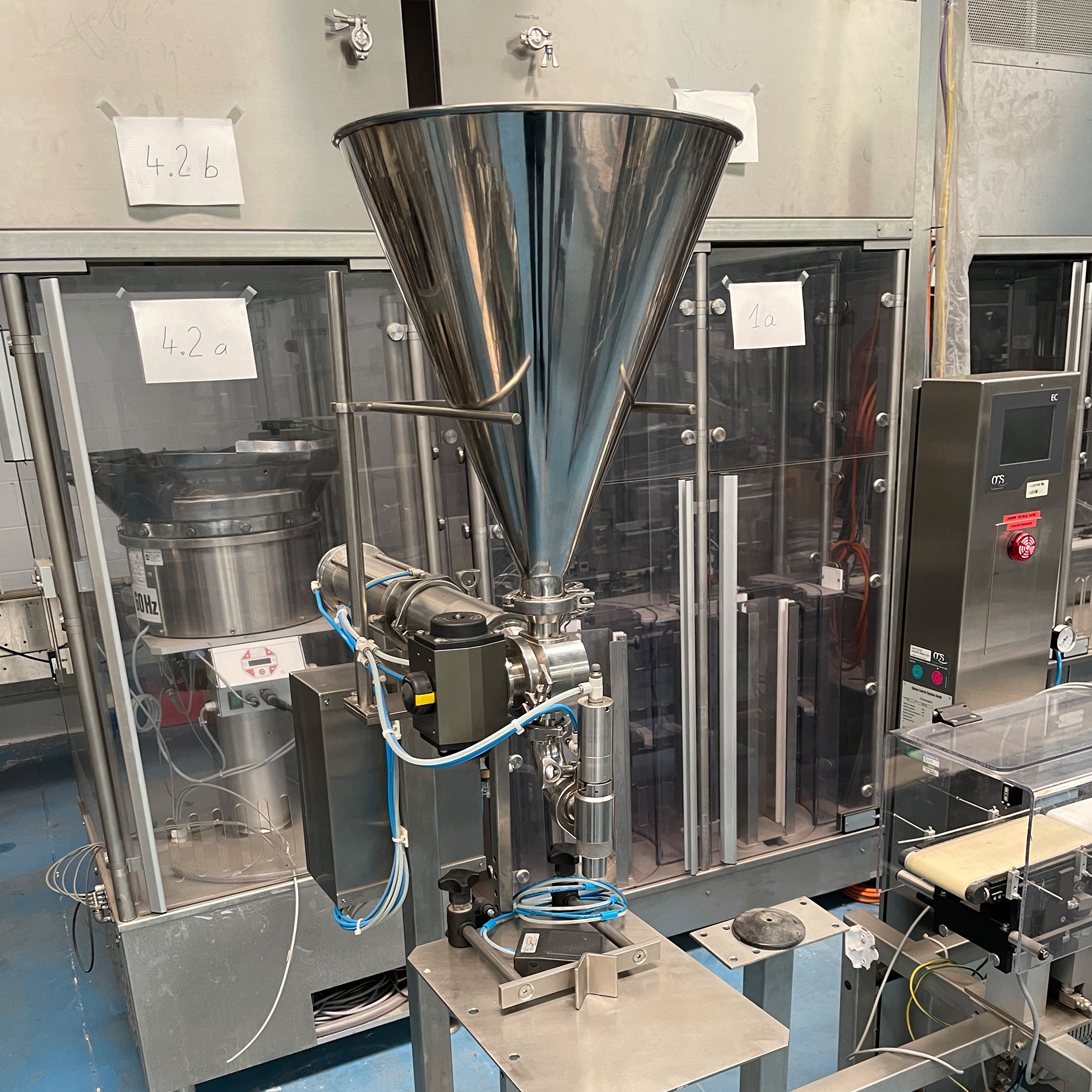 Veterinary at the farm walking in cowshed checking the cows